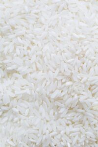 how many grams in a cup of rice cooked?