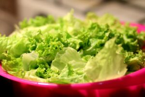 how many grams in a cup of lettuce?